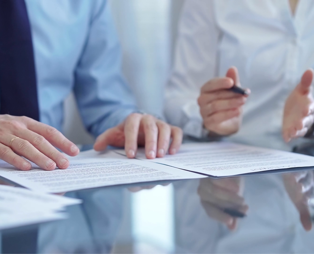 Business meeting with documents on table.